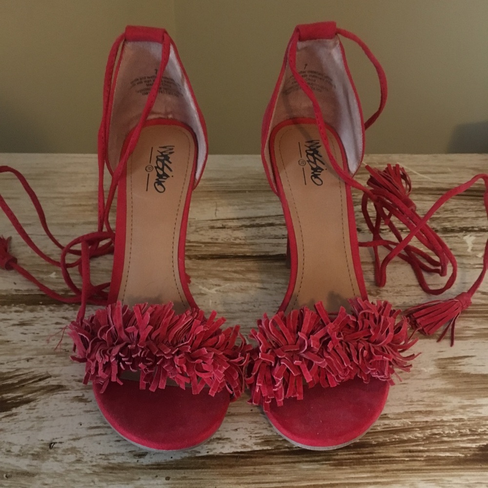 Red tassel heels